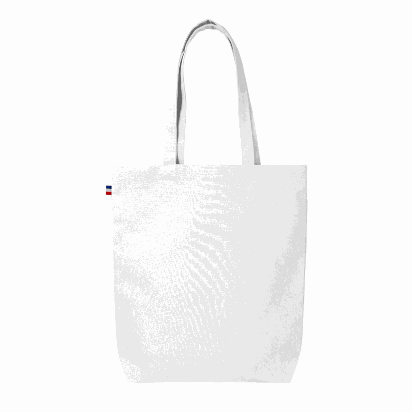 Sac cabas en coton beige avec soufflet de fond, fabriqué en France, posé sur une table en bois avec accessoires de mode